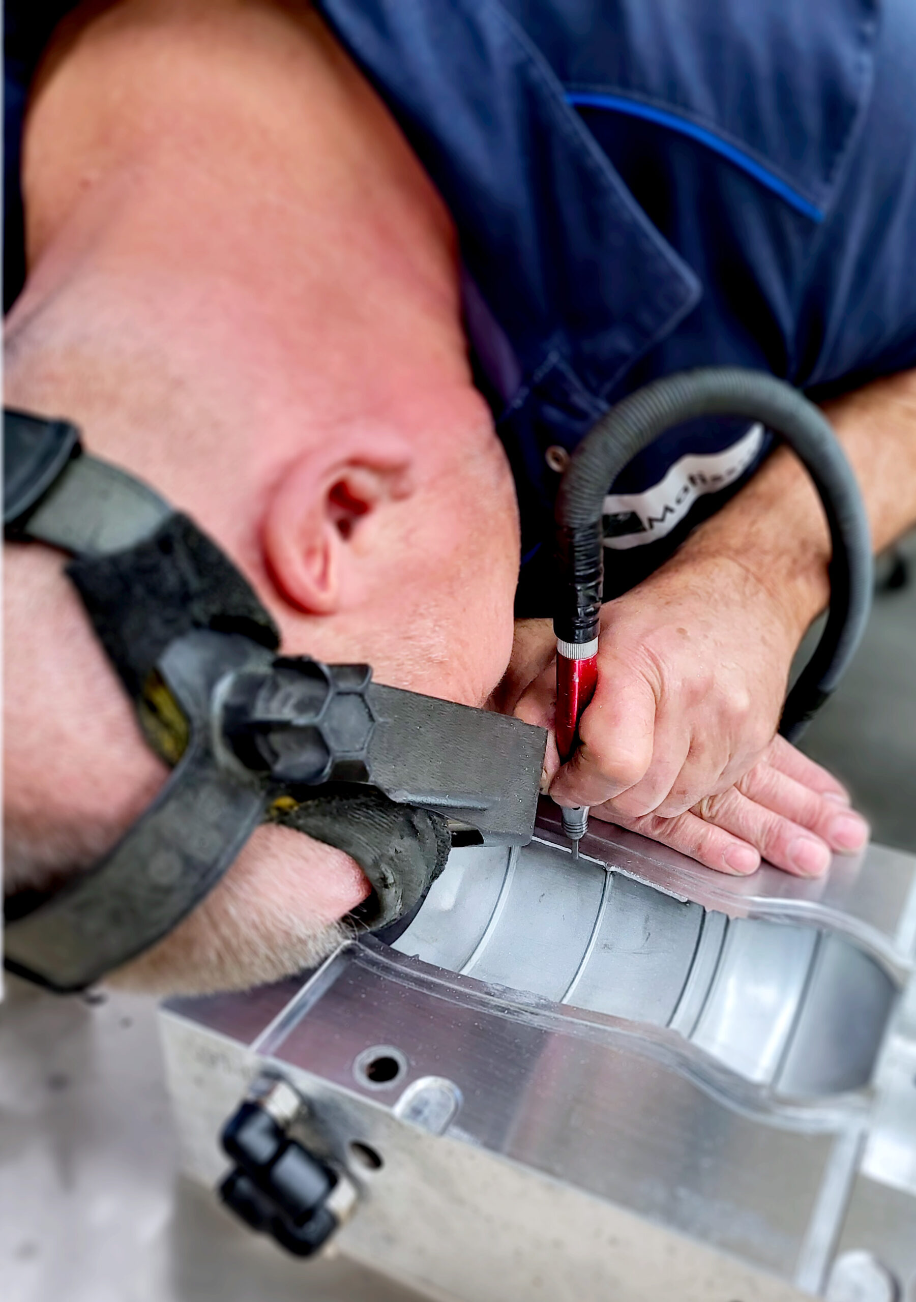 Picture of a tool maker working on the parting line of a single cavity mold